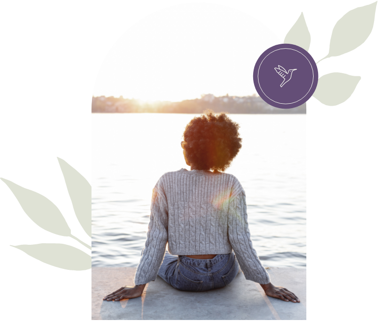 Lady sitting by water